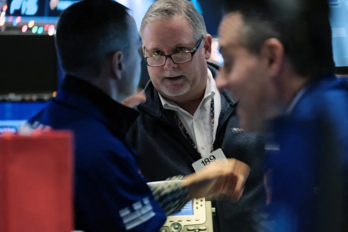 Traders work on the floor of the New York Stock Exchange, on Dec 15, 2022 in New York City.