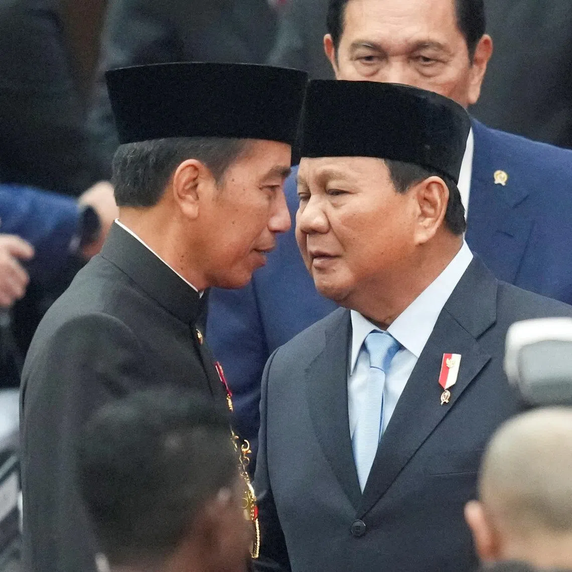 For some observers, Mr Joko Widodo (left) had never really left - a state of affairs that is complicating his relationship with President Prabowo Subianto.