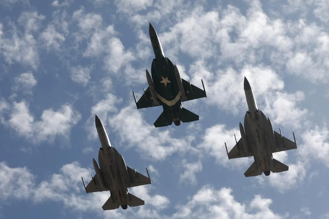 Pakistan Air Force (PAF) JF-17 Thunder jets perform during an air show in Karachi, Pakistan February 27, 2020. REUTERS/Akhtar Soomro