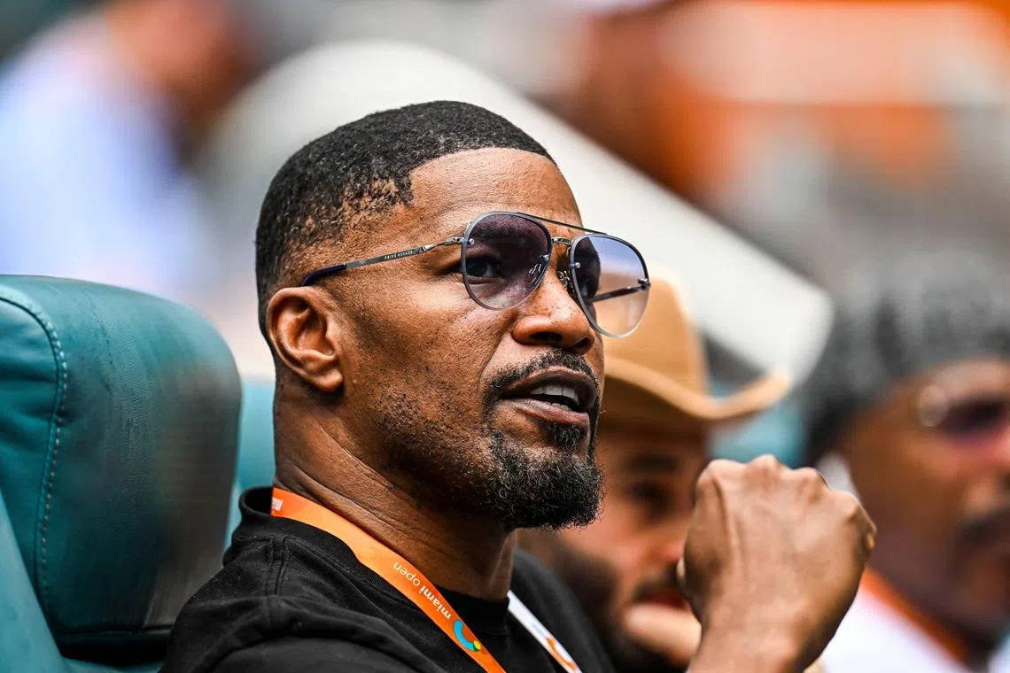 (FILES) In this file photo taken on March 30, 2023 US actor Jamie Foxx attends the men’s quater-final match between Christopher Eubanks of the US and Daniil Medvedev of Russia at the 2023 Miami Open at Hard Rock Stadium in Miami Gardens, Florida. - Oscar-winning US actor Jamie Foxx has been hospitalized with an unspecified medical complication but is in recovery, his family says on April 13, 2023. (Photo by CHANDAN KHANNA / AFP)