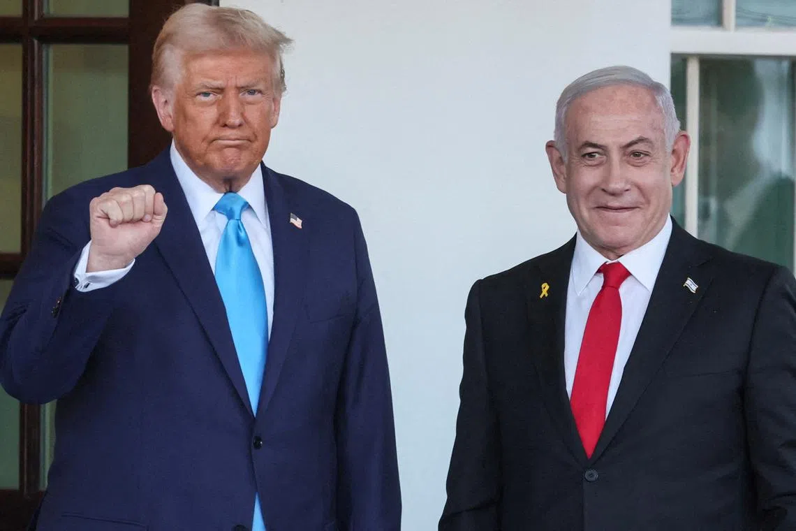 FILE PHOTO: U.S President Donald Trump welcomes Israeli Prime Minister Benjamin Netanyahu at the entrance of the White House in Washington, U.S., February 4, 2025. REUTERS/Leah Millis/File Photo