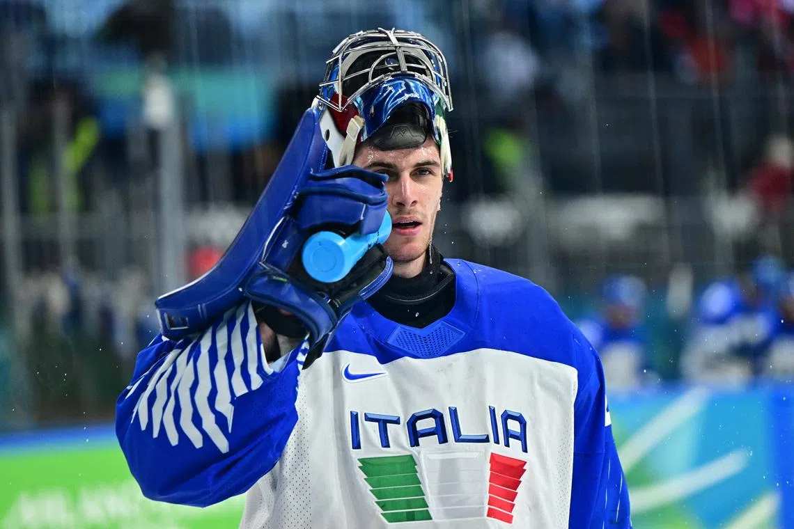 Milano Cortina 2026 Olympics - Ice Hockey - Men's Qualification Play-off - Switzerland vs Italy - Milano Rho Ice Hockey Arena, Milan, Italy - February 17, 2026. Damian Clara of Italy drinks water during a break in play REUTERS/Marton Monus