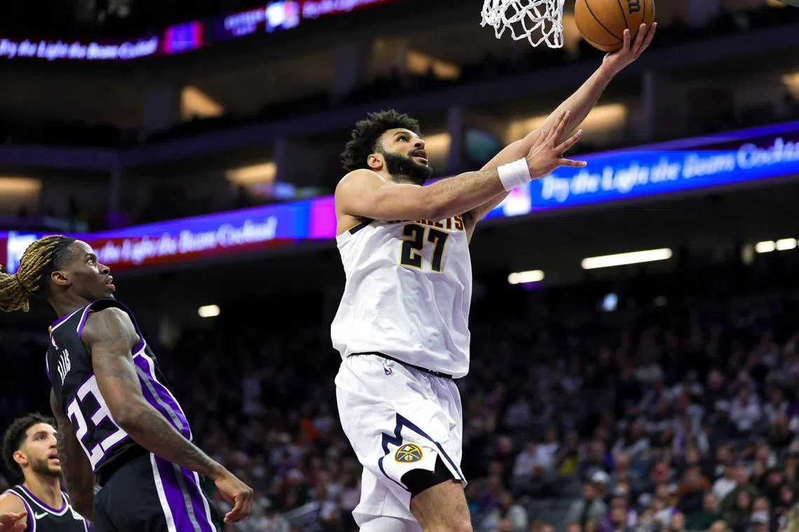 Dec 16, 2024; Sacramento, California, USA; Denver Nuggets guard Jamal Murray (27) drives to the basket against Sacramento Kings guard Keon Ellis (23) during the second quarter at Golden 1 Center. Mandatory Credit: Sergio Estrada-Imagn Images/ File Photo