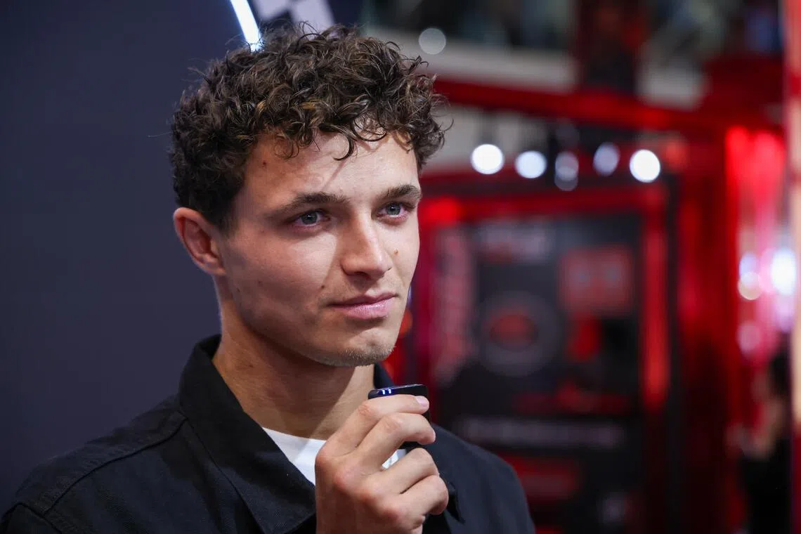 McLaren's Lando Norris speaking to ST at Ralph Lauren Fragrances’ Polo Red Racing pop-up event at Plaza Singapura.