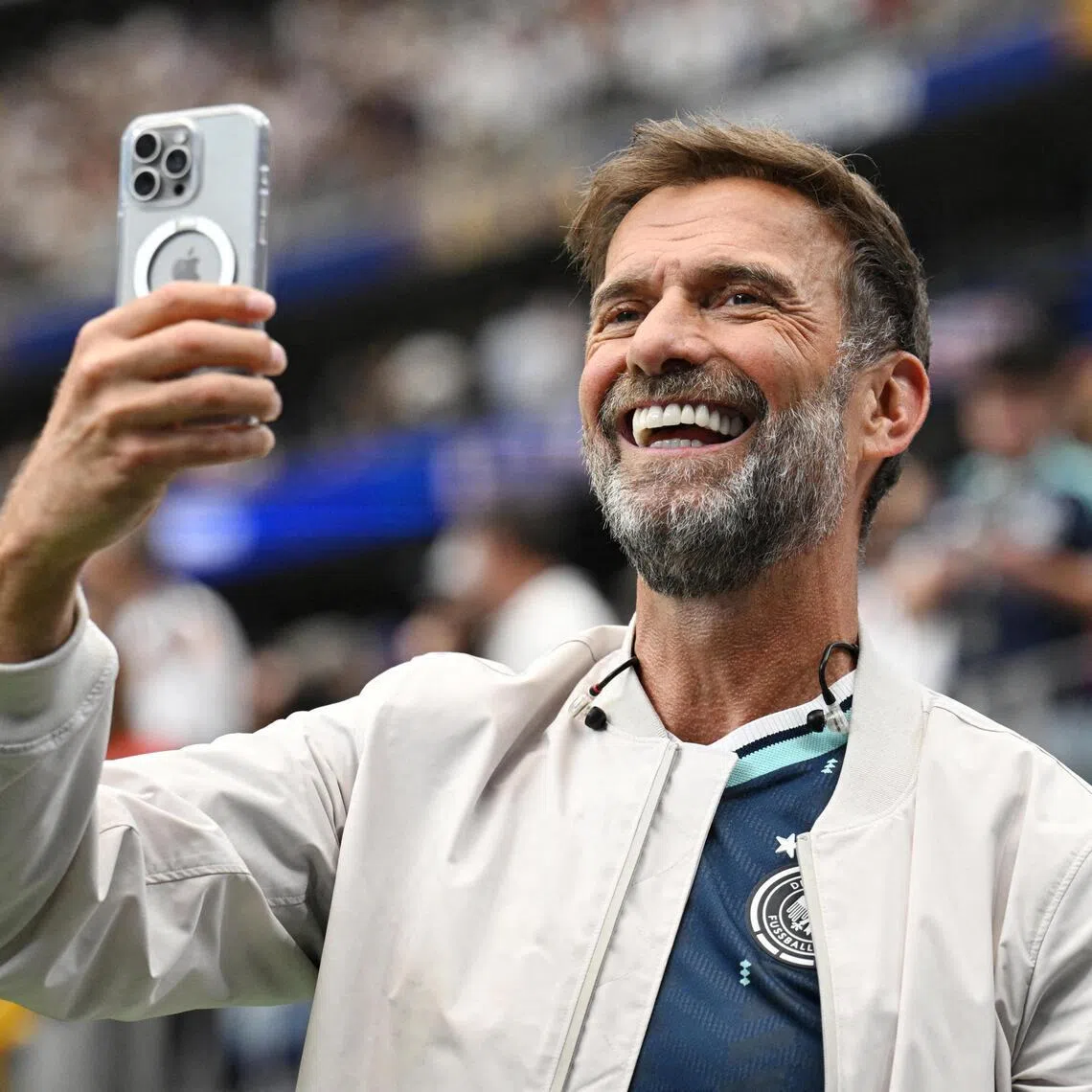 FILE PHOTO: Soccer Football - FIFA World Cup 2026 - Group E - Germany v Curacao - Houston Stadium, Houston, Texas, U.S. - June 14, 2026
Red Bull's Global Head of Soccer Juergen Klopp takes a photograph inside the stadium after the match REUTERS/Annegret Hilse/File Photo