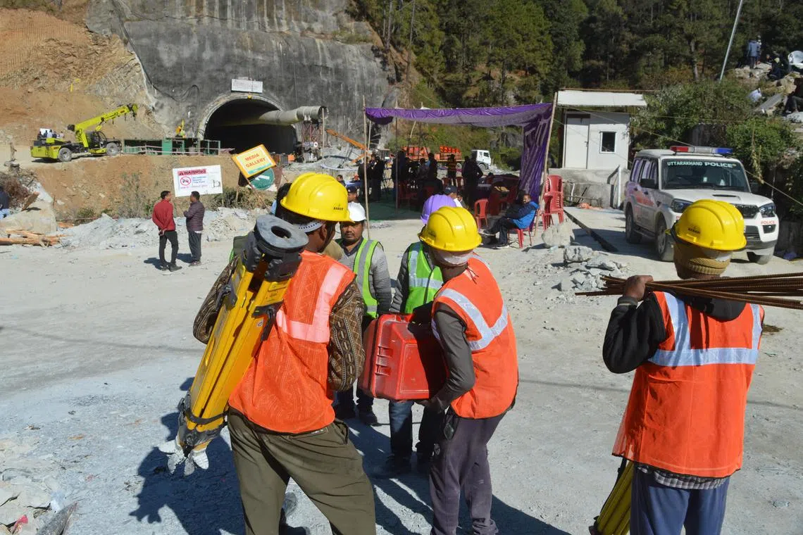 Rescue workers continue operations at the site of an under-construction tunnel on Nov 19, 2023.