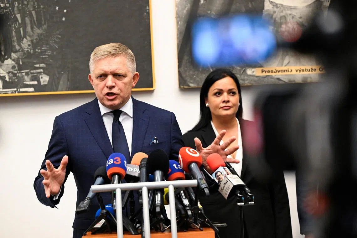 FILE PHOTO: Slovakia's Prime Minister Robert Fico speaks during his visit of Handlova, the town where a gunman shot him in May in an attempted assassination, as Mayor of Handlova Silvia Gruberova listens, in Handlova, Slovakia, September 6, 2024. REUTERS/Radovan Stoklasa/File Photo