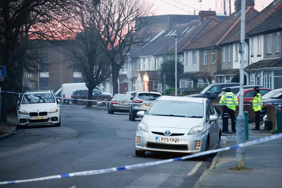 Police in a cordoned off area where a fire broke out at a substation serving Heathrow Airport in Hayes, west London, on March 21.