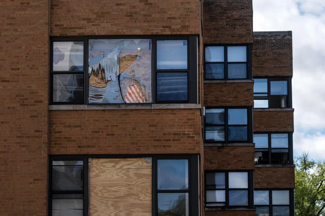 Windows are boarded up at an apartment building in Chicago’s South Shore neighborhood, where federal agents staged a massive raid. 