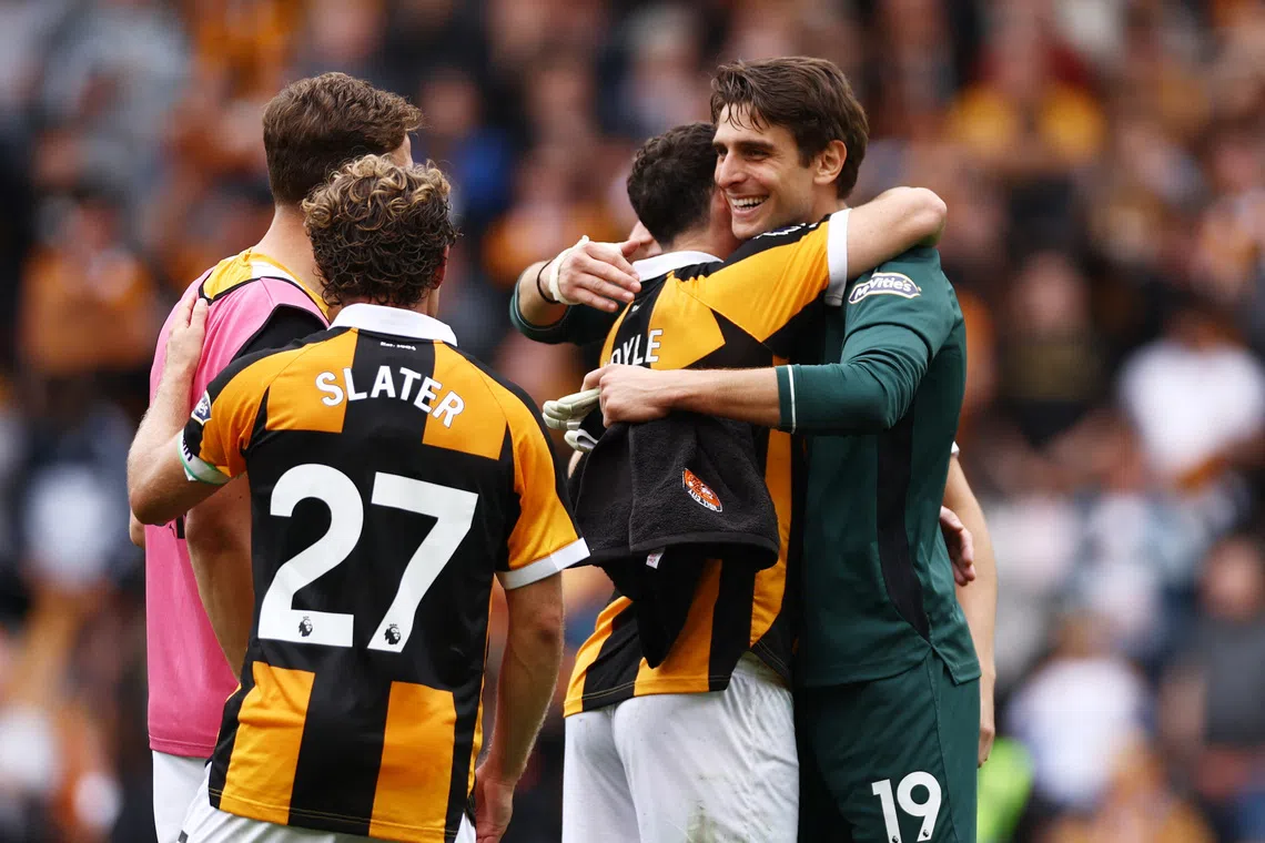 Soccer Football - Premier League - Hull City v Manchester United - MKM Stadium, Hull, Britain - August 22, 2026 Hull City's Konstantinos Tzolakis and Lewie Coyle celebrate after the match Action Images via Reuters/Lee Smith