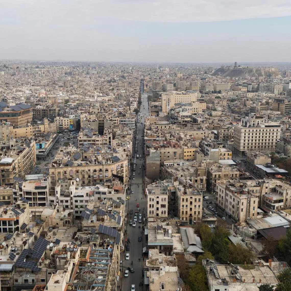 FILE PHOTO: A drone view shows buildings and the ancient citadel, in Aleppo, Syria, December 4, 2024. REUTERS/Karam al-Masri
