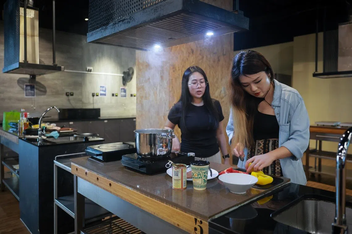 At Coliwoo Boon Lay, tenants can mingle at shared facilities such as a kitchen (pictured), lounge and gym.
