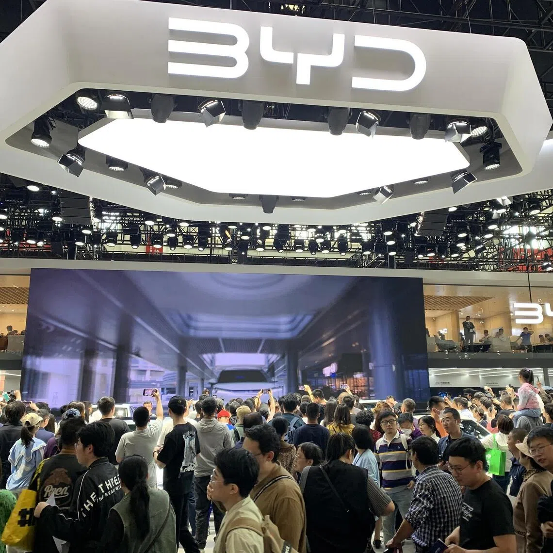 Crowds thronging the booth of China’s largest NEV maker BYD at the Beijing International Automotive Exhibition on May 2, 2024.