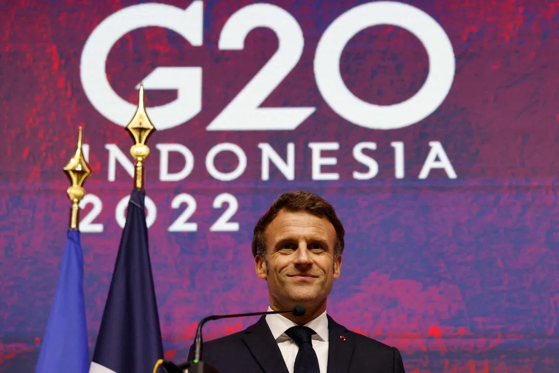 French President Emmanuel Macron holds a press conference at the G-20 summit in Nusa Dua on the Indonesian resort island of Bali.