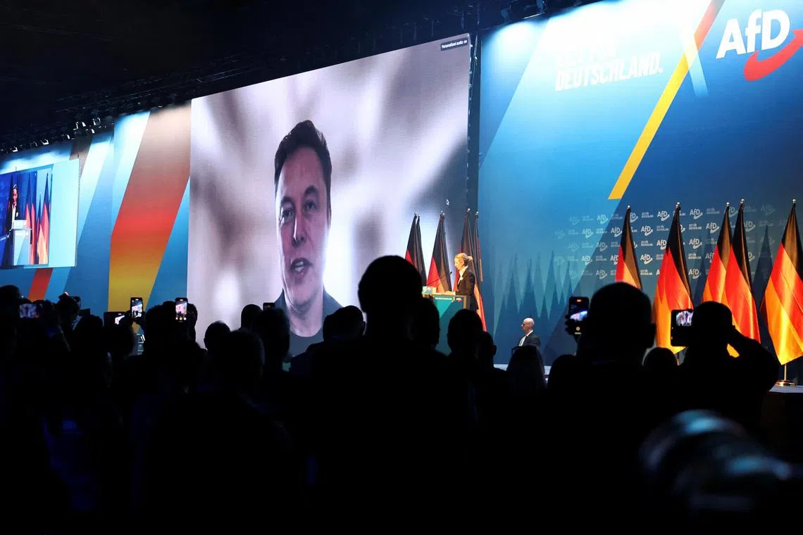 US billionaire Elon Musk speaking on screen during a campaign event for Germany's far-right AfD in Halle, Germany, on Jan 25.