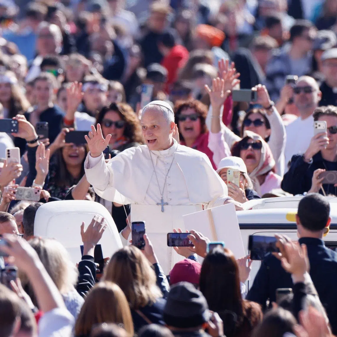 Pope Leo XIV gestures as he arrives for a weekly general audience in Saint Peter's Square at the Vatican April 8, 2026.