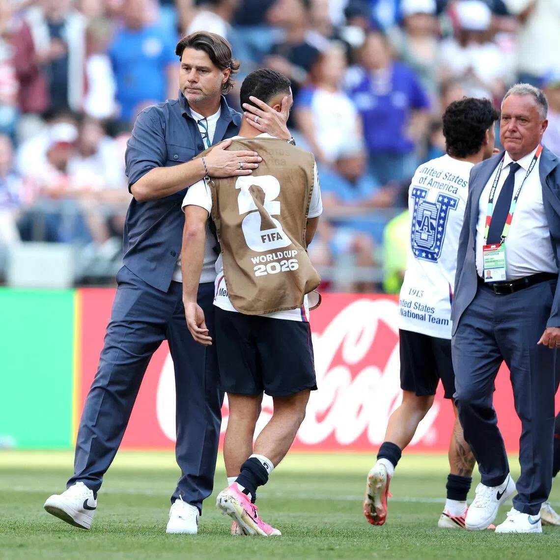 USA coach Mauricio Pochettino and his team  after losing 4-1 to Belgium at the World Cup on July 6.