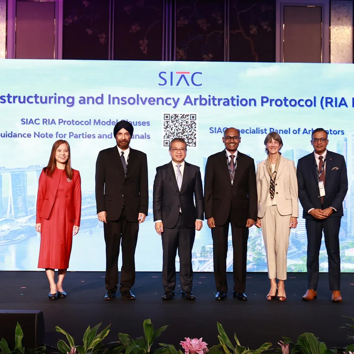 Minister for Law and Second Minister for Home Affairs Edwin Tong (third from left), Justice Kannan Ramesh (fourth from left), and representatives from the Singapore International Arbitration Centre (SIAC) officially launched the SIAC Restructuring and Insolvency Arbitration Protocol at the SIAC Symposium 2025. PHOTO: MINISTRY OF LAW