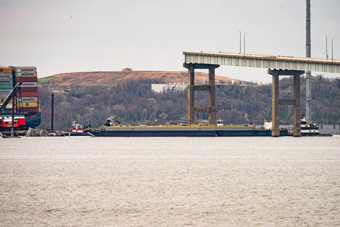 A fuel barge is pushed by Tugboat Crystal Coast, the first vessel to transit a new temporary alternate channel near the Dali container vessel after it struck the Francis Scott Key Bridge that collapsed into the Patapsco River in Baltimore, Maryland, US, on Monday, April 1, 2024. Ports along the US East Coast are modifying their operations to absorb cargo diverted from Baltimore harbor, where salvage specialists are starting the daunting task of clearing debris from the destroyed Francis Scott Key Bridge. Photographer: Al Drago/Bloomberg