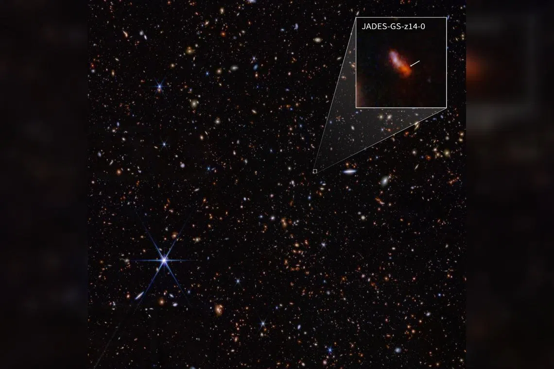 A Nasa image shows the JADES-GS-z14-0 galaxy, a bright star system that existed just 290 million years after the Big Bang.
