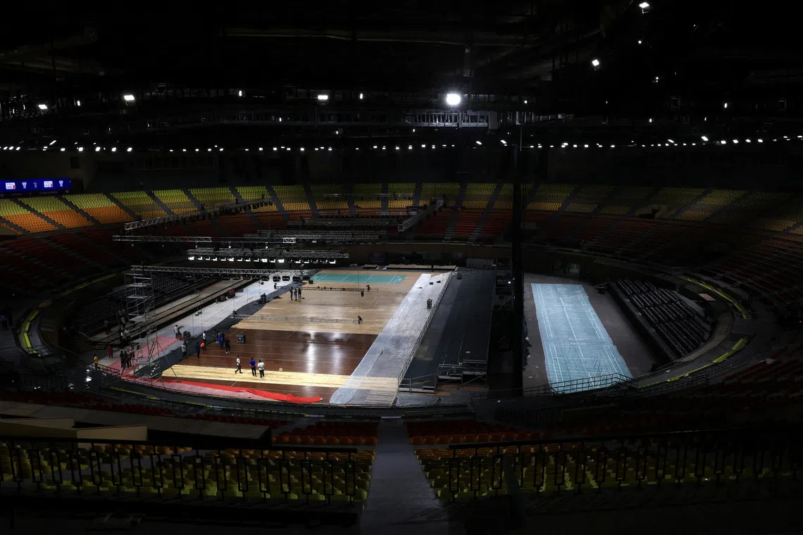 Workers prepare badminton courts for the upcoming BWF World Championships inside the Indira Gandhi Indoor Stadium in New Delhi, India, August 10, 2026. REUTERS/Bhawika Chhabra