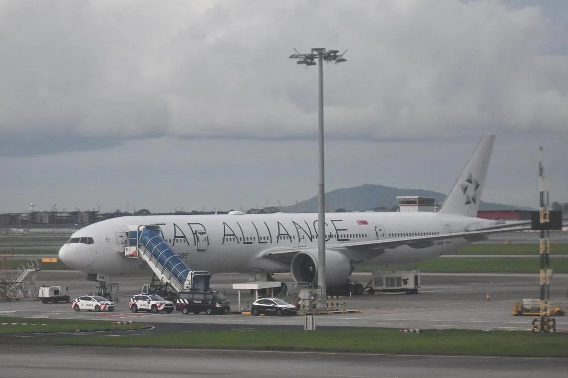 ST20240526-202401546469-Lim Yaohui-Samuel Devaraj-pixsq321/
SIA Plane, 9V-SWM, a Boeing 777-300ER, involved in SQ321 incident, returned back to Singapore at Changi Airport, photographed at 5.16pm on May 26, 2024.
The Singapore Airlines (SIA) plane which experienced severe air turbulence on May 21, resulting in one death and dozens of injuries, returned to Singapore on May 26 after being cleared for departure from Bangkok.
In response to queries from The Straits Times, an SIA spokesperson said that aircraft 9V-SWM, a Boeing 777-300ER, was flown back from Bangkok on May 26 and landed at 1.39pm.
(ST PHOTO: LIM YAOHUI)