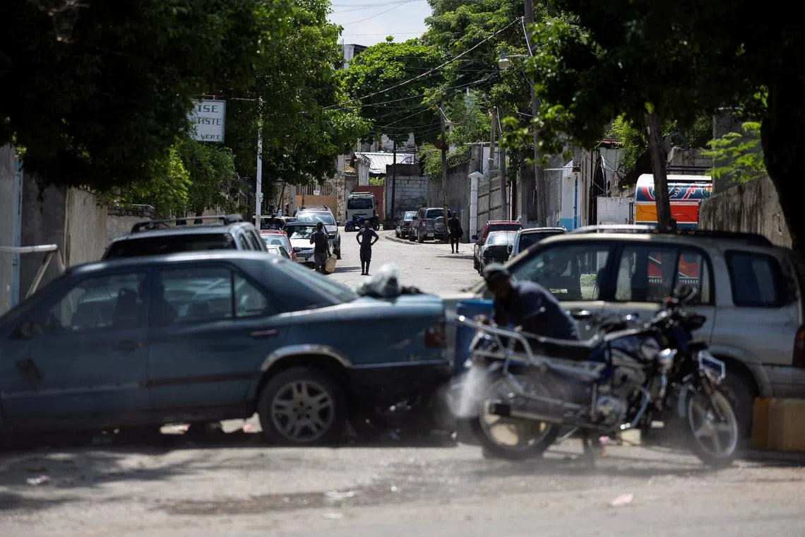 A view of a makeshift barricade built by residents out of abandoned vehicles to block a road and prevent gangs from entering their community, in Port-au-Prince, Haiti May 5, 2024. REUTERS/Ricardo Arduengo