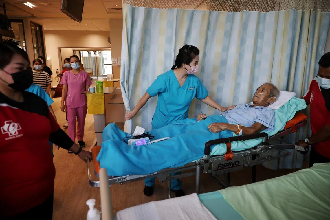 Dover Park Hospice patient Yang Tsin Hoong arriving at his new ward at the TTSH integrated care hub on Oct 30.