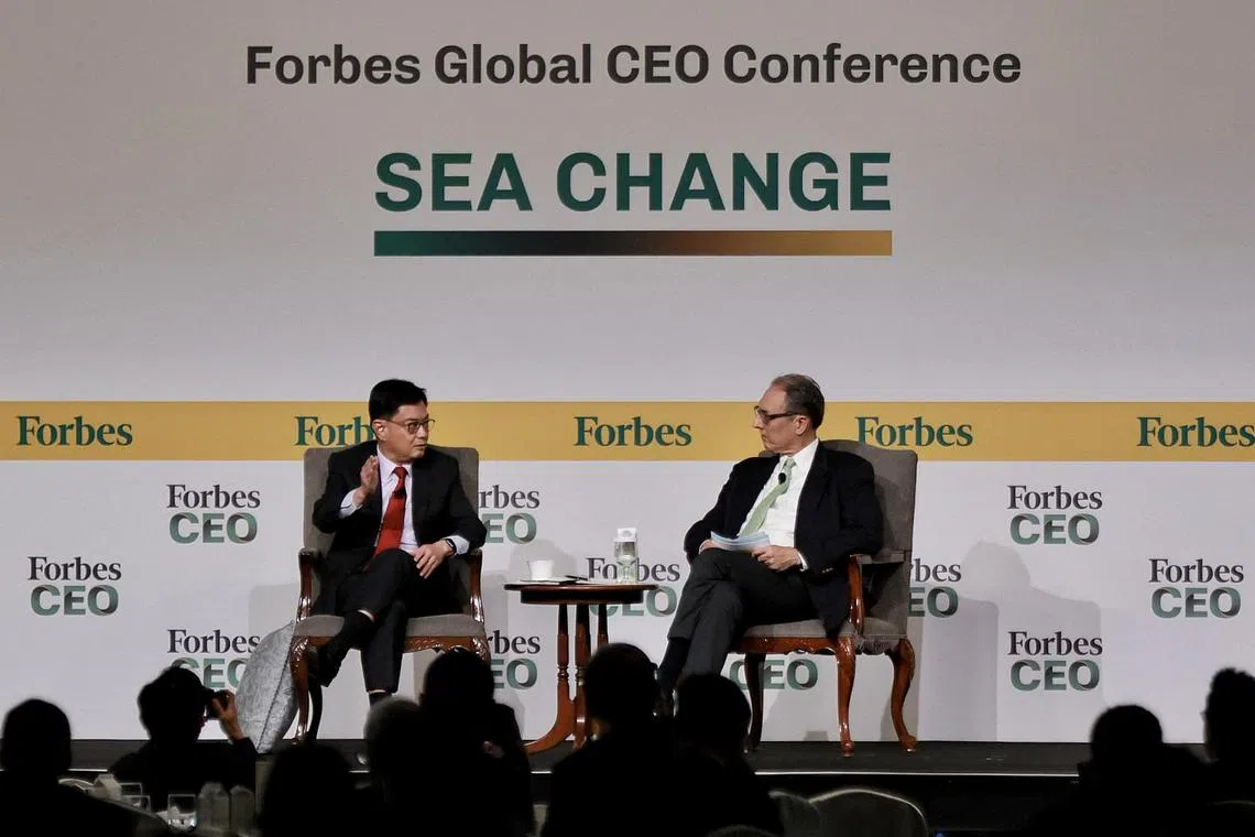 DPM Heng Swee Keat speaking with moderator Justin Doebele at a dialogue session during the Forbes Global CEO Conference at Shangri-La Singapore on Sept 11.