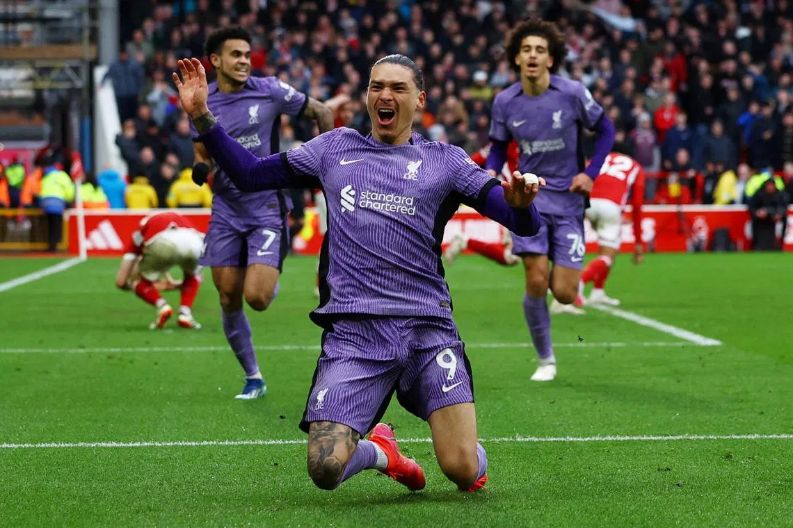 Darwin Nunez celebrates scoring for Liverpool in the 99th minute to win the match.