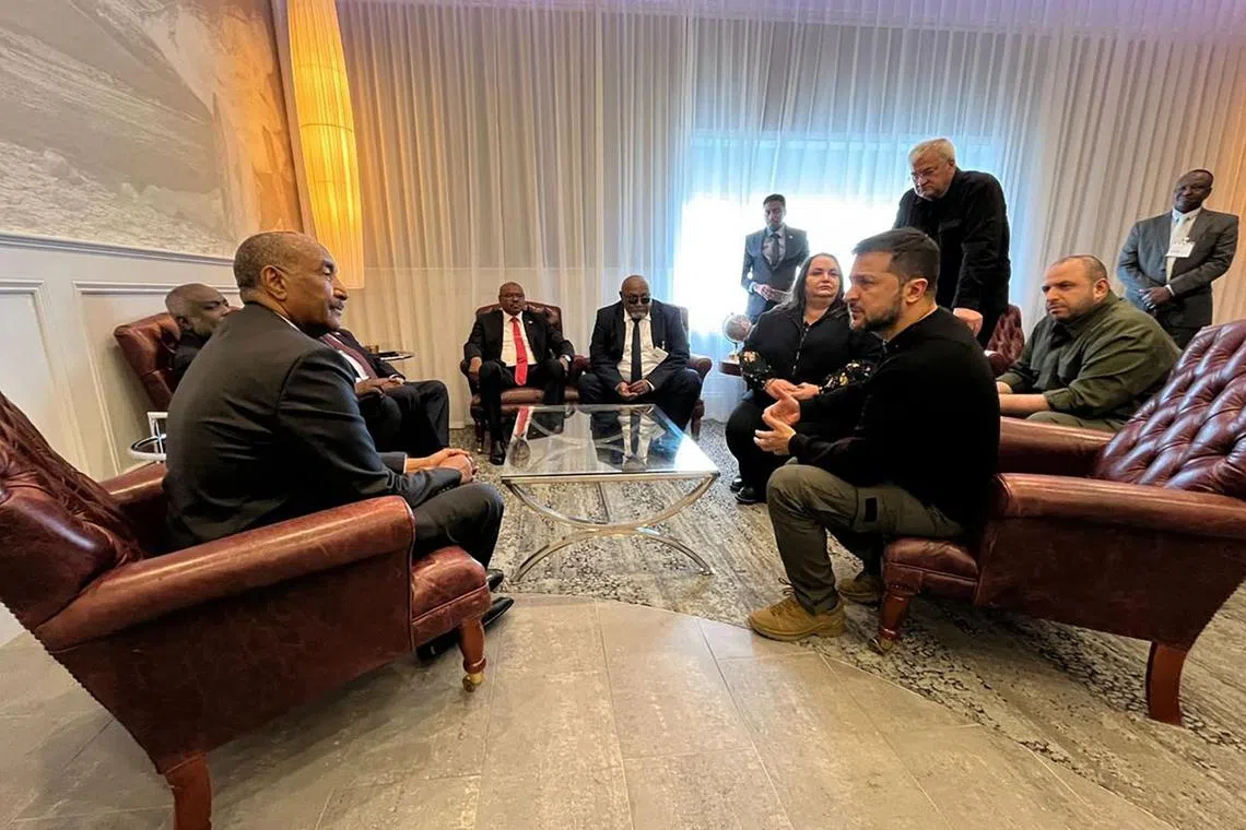 In this handout photograph taken and released by Ukrainian Presidential Press Service on September 23, 2023, Ukraine's President Volodymyr Zelensky (R) speaks with President of Sudan's Transitional Sovereignty Council Abdel Fattah al-Burhan (L) during their meeting at Shannon Airport, in Shannon, western Ireland. (Photo by Handout / UKRAINIAN PRESIDENTIAL PRESS SERVICE / AFP) / RESTRICTED TO EDITORIAL USE - MANDATORY CREDIT "AFP PHOTO / UKRAINIAN PRESIDENTIAL PRESS SERVICE " - NO MARKETING NO ADVERTISING CAMPAIGNS - DISTRIBUTED AS A SERVICE TO CLIENTS