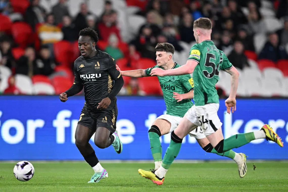 Nestory Irankunda (left) in action for the A-League All Stars against Newcastle United in Melbourne on May 24, 2024.