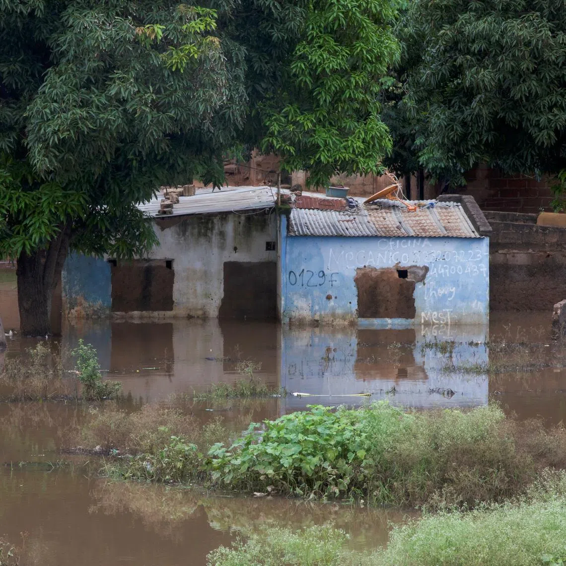 A house stands partially submerged in floodwater after weeks of heavy rainfall in Maputo, Mozambique, January 21, 2026. REUTERS/Amilton Neves