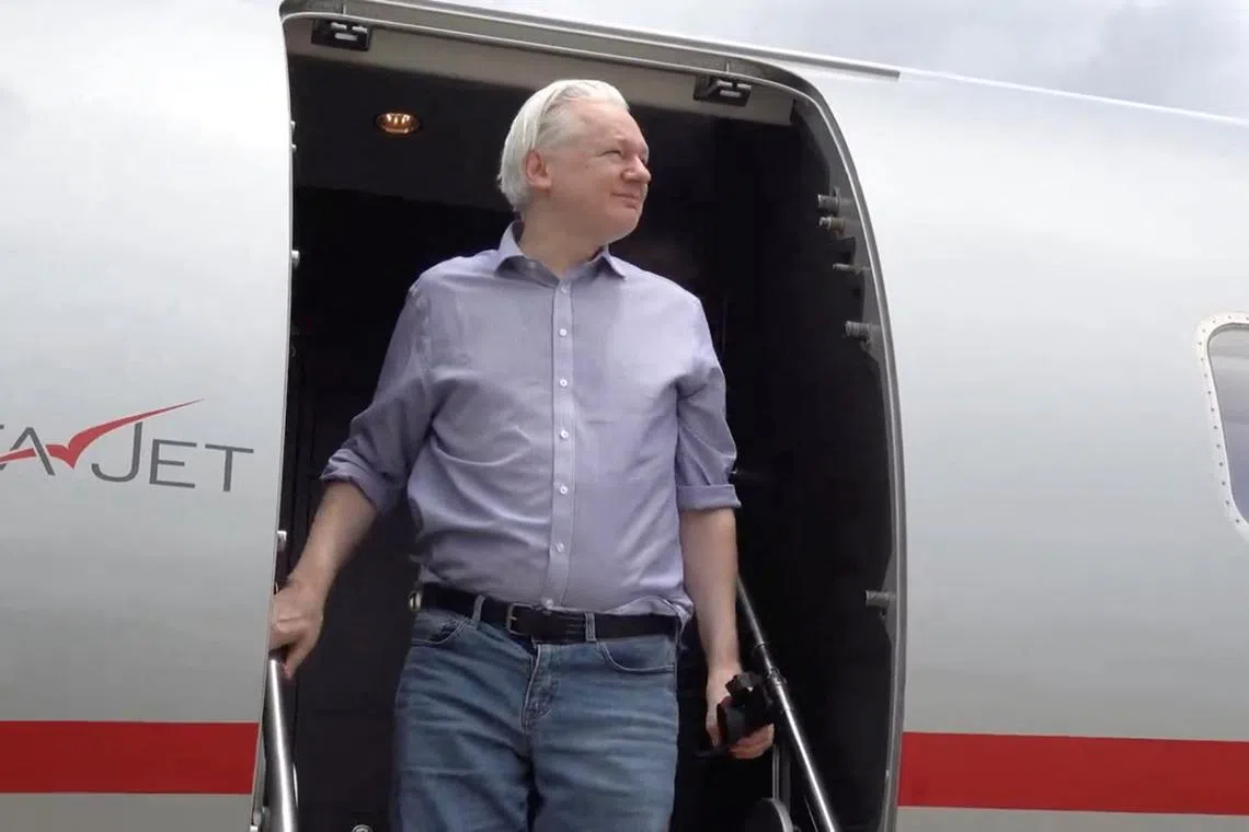 WikiLeaks founder Julian Assange disembarks from a plane at Bangkok Don Mueang International Airport, Thailand, in this screengrab from a video released to social media on June 25, 2024. Wikileaks via X/via REUTERS