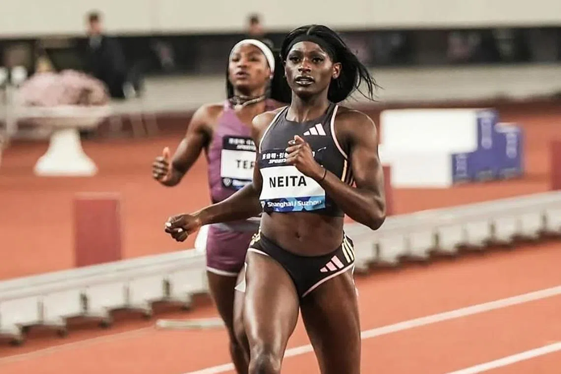 Daryll Neita winning the women's 200m at the Diamond League meeting in Suzhou on April 27.