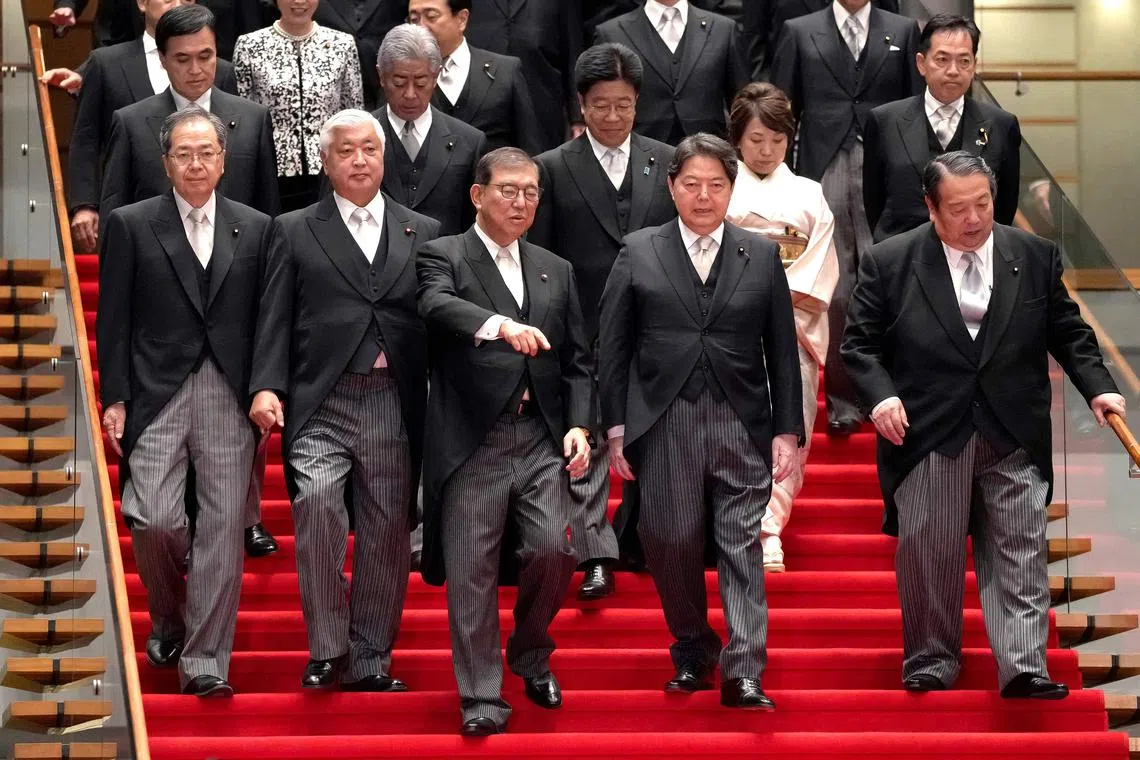 Japanese Prime Minister Shigeru Ishiba (front row, centre) arriving for a photo session with his Cabinet members on Oct 1.