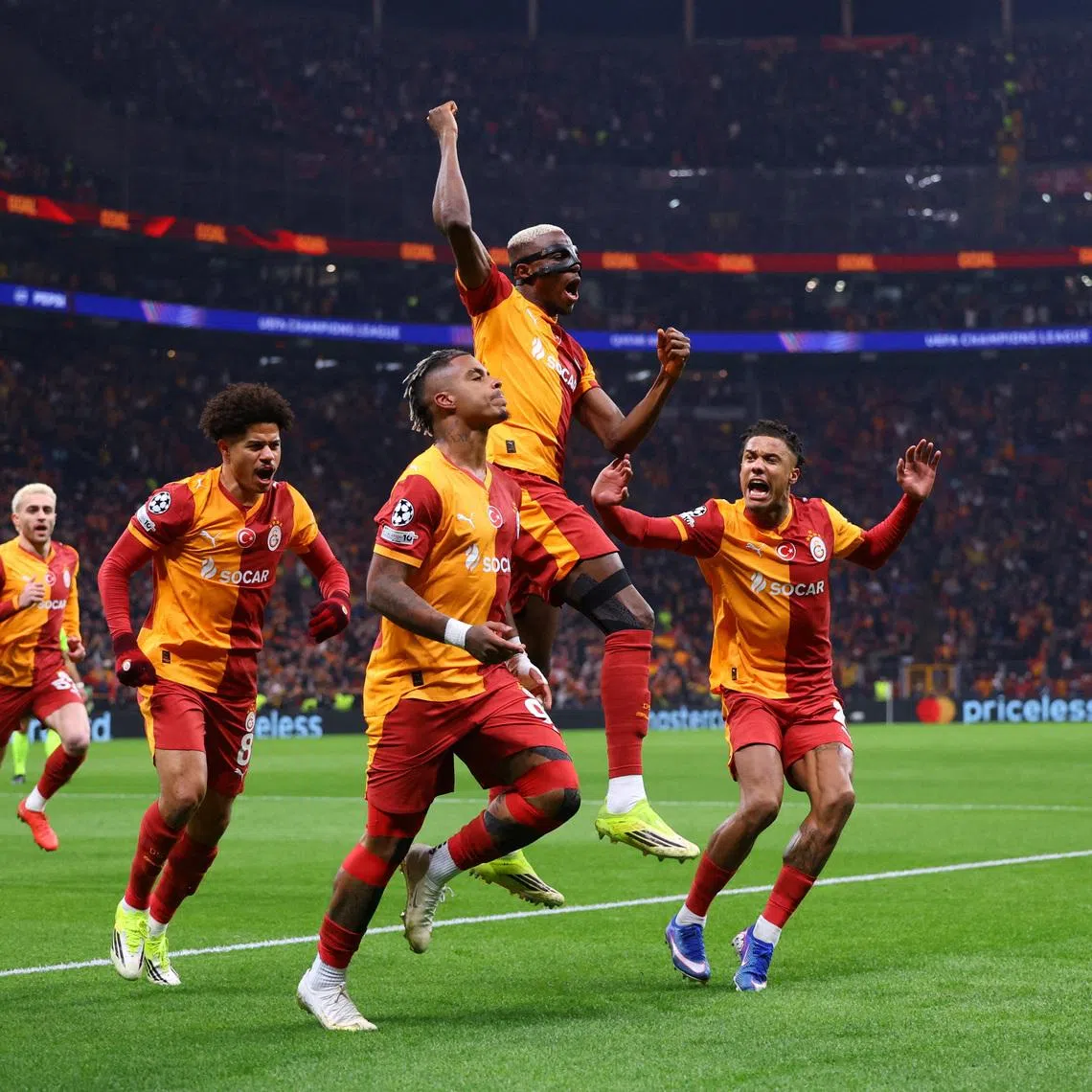 Soccer Football - UEFA Champions League - Round of 16 - First Leg - Galatasaray v Liverpool - Rams Park, Istanbul, Turkey - March 10, 2026 Galatasaray's Mario Lemina celebrates scoring their first goal with Victor Osimhen REUTERS/Murad Sezer