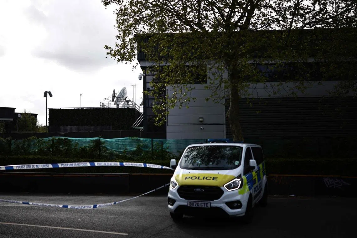 A police van parked outside of a warehouse park housing offices of television station Iran International in London on April 16.