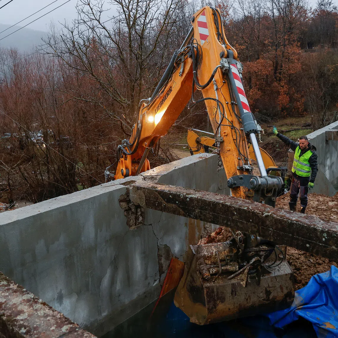 Workers repair the damaged canal in northern Kosovo, supplying water to two coal-fired power plants that generate nearly all of the country's electricity, in Varage, near Zubin Potok, Kosovo November 30, 2024. REUTERS/Valdrin Xhemaj
