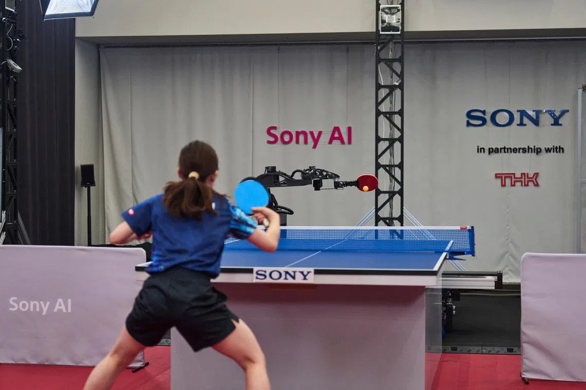 Sony AI autonomous robot Ace fires a shot back to its human opponent, table tennis player Minami Ando, during a match in December 2025 in Tokyo, Japan, as seen in this photograph released on April 22, 2026. Sony AI/Handout via REUTERS