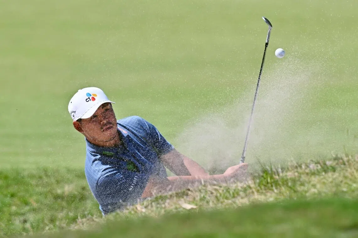 South Korea's Kim Si-woo hitting out of a bunker during the final round of the Australian Open golf tournament at the Royal Melbourne Golf Club in Melbourne on Dec 7, 2025.