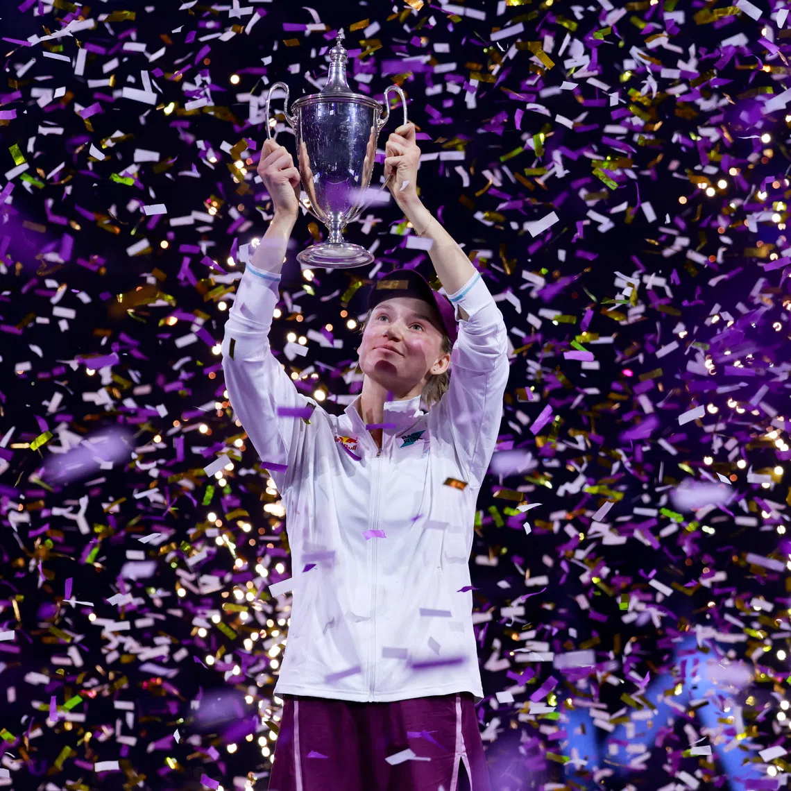 Tennis - WTA Finals - Riyadh - King Saud University Indoor Arena, Riyadh, Saudi Arabia - November 8, 2025 Kazakhstan's Elena Rybakina celebrates with the trophy after winning the final match against Belarus' Aryna Sabalenka REUTERS/Stephanie Lecocq