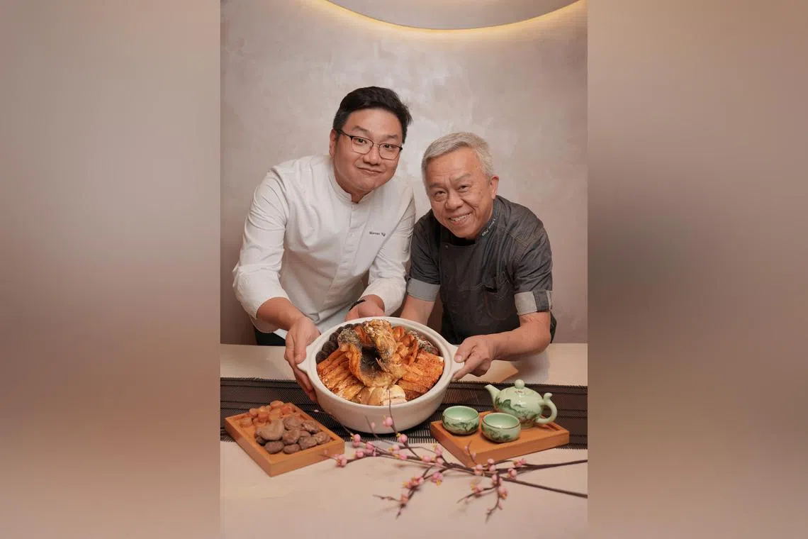 Chef Marvas Ng (left) of Path and Chef Ang Song Kang with their Chefs' Harmony Pen Cai for Chinese New Year. 