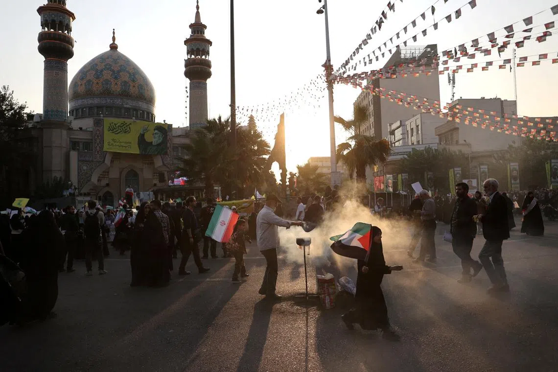 Iranians attend an anti-Israel gathering in Tehran, Iran, October 8, 2024. Majid Asgaripour/WANA (West Asia News Agency) via REUTERS