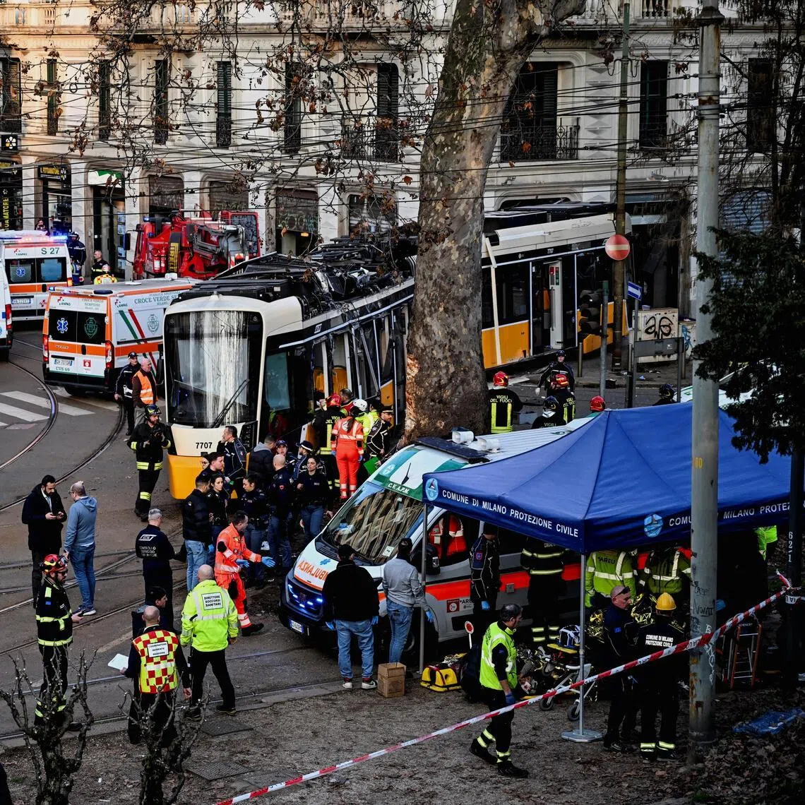 Emergency personnel working at the scene of a deadly tram derailment in Milan, Italy, on Feb 27.