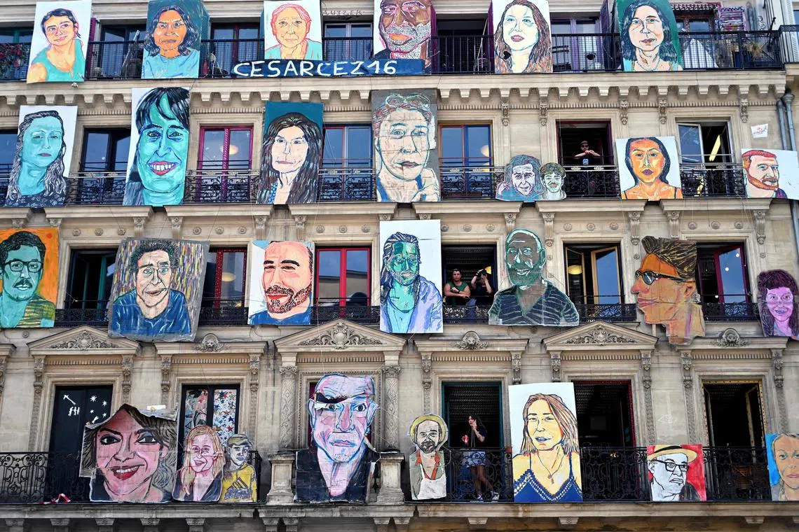 People visiting 59 Rivoli Art Gallery as art works of French artist Cesar Seize are exhibit on the building facade in Paris, on July 9, 2023. 