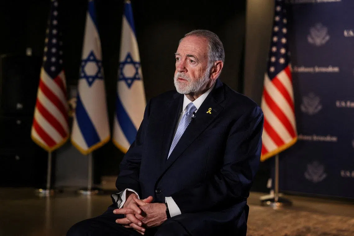 FILE PHOTO: U.S. Ambassador to Israel Mike Huckabee looks on during an interview with Reuters in Jerusalem, September 10, 2025. REUTERS/Ronen Zvulun/File Photo