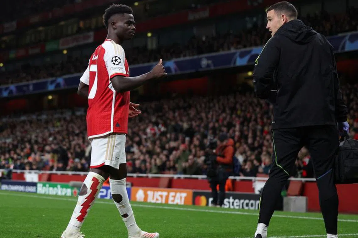 Soccer Football - Champions League - Group B - Arsenal v Sevilla - Emirates Stadium, London, Britain - November 8, 2023 Arsenal's Bukayo Saka walks off the pitch after sustaining an injury REUTERS/Hannah Mckay