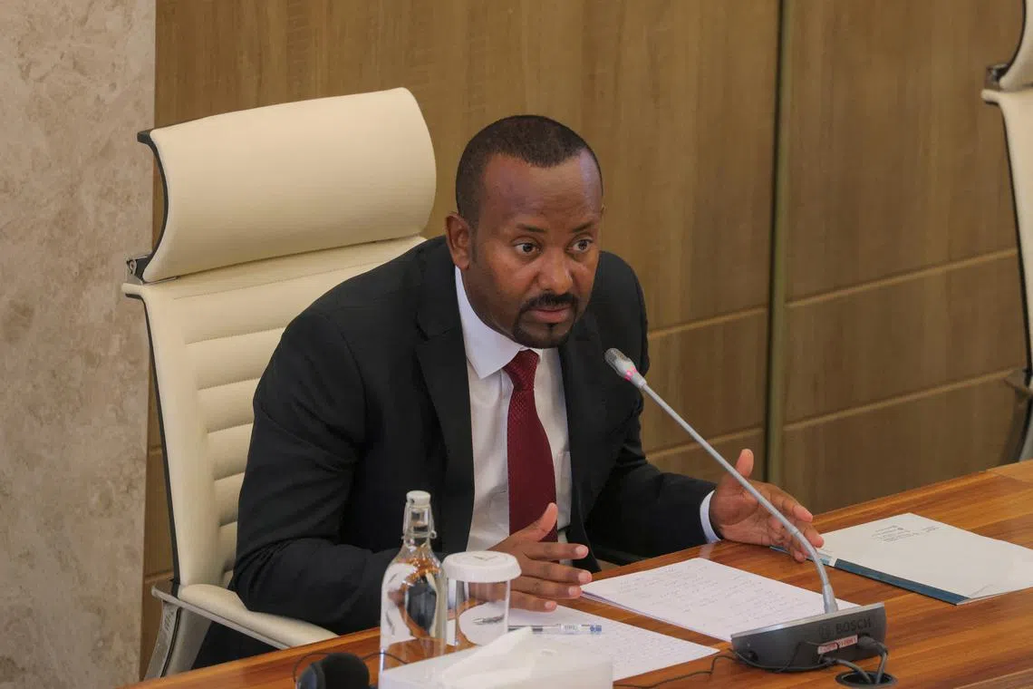 FILE PHOTO: Ethiopia's Prime Minister Abiy Ahmed addresses parliament members on the current situation of the country at the parliament building in Addis Ababa, Ethiopia, March 20, 2025. REUTERS/Tiksa Negeri/File Photo