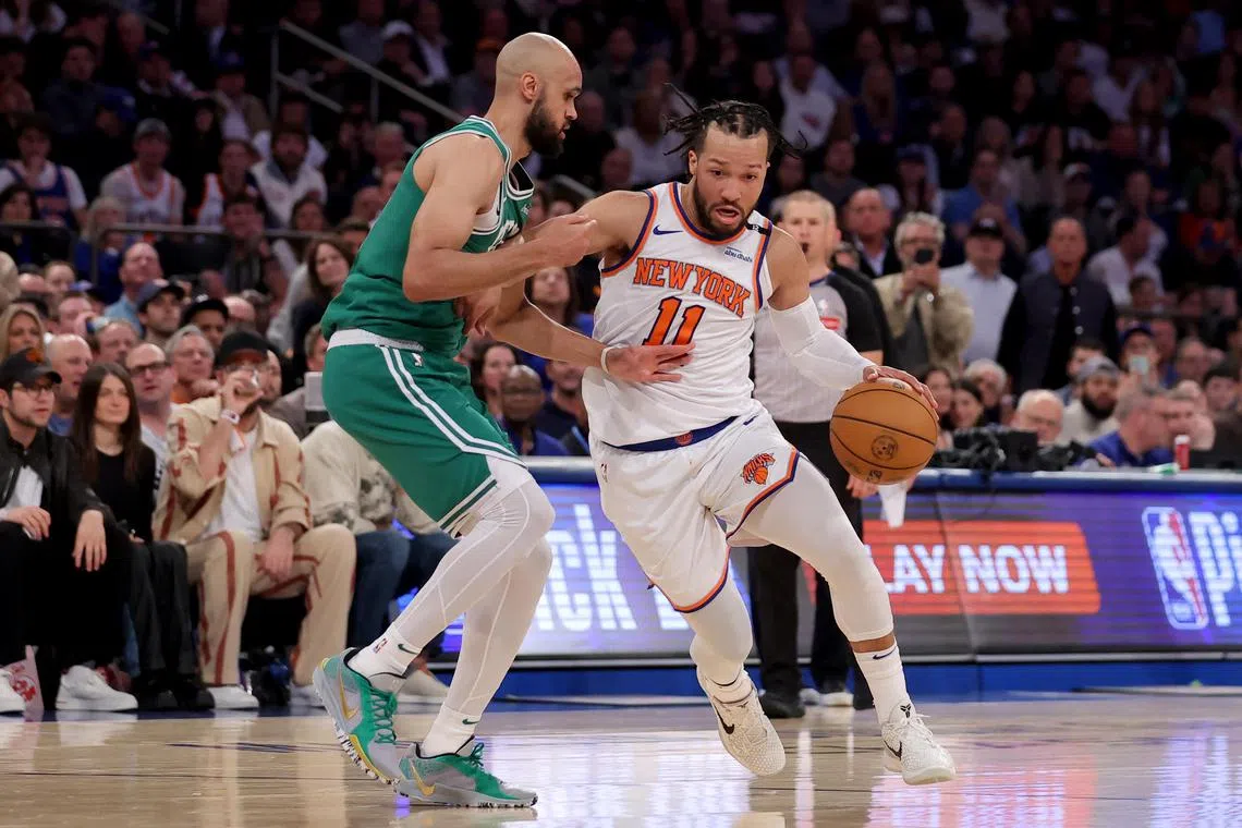 New York Knicks guard Jalen Brunson drives to the basket against Boston Celtics guard Derrick White during the second quarter of Game 6.